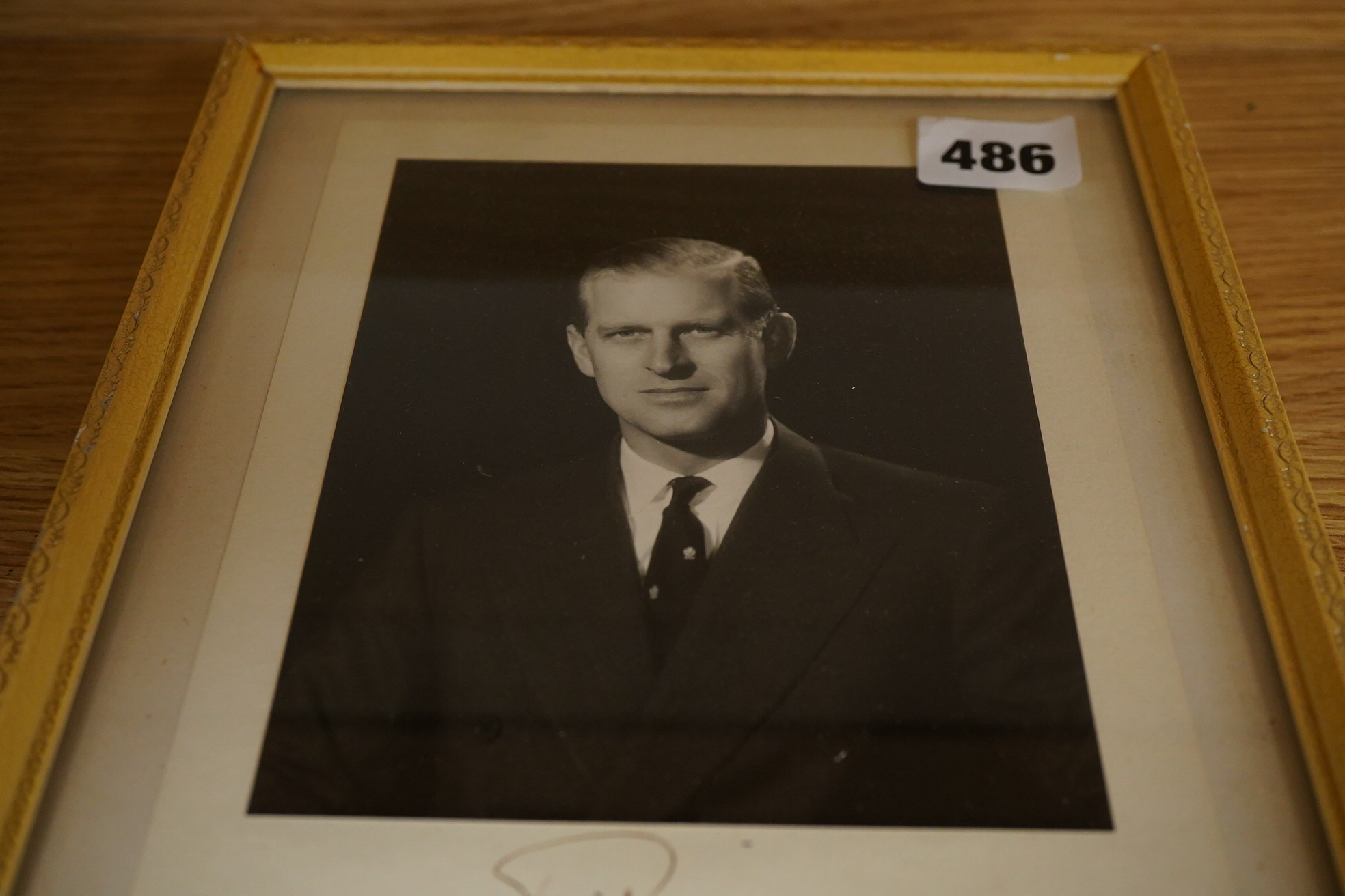 Two autographed photographs of Prince Philip dated 1957, framed